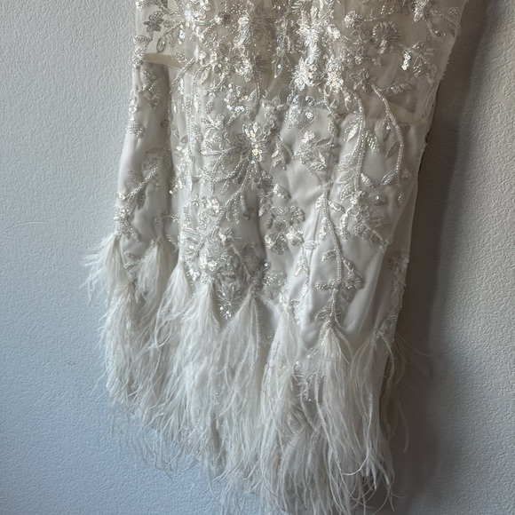 Jovani Scoop neck flower embellished bodice with mesh and a feathered Miniskirt. - Picture 7 of 10